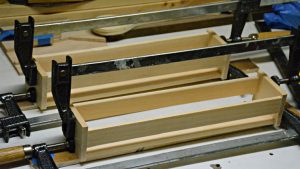 mini wooden crates in clamps